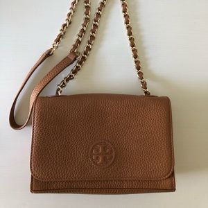 Brand new Tory Burch crossbody in tan. Metal straps, built in wallet, 7x5x2.5